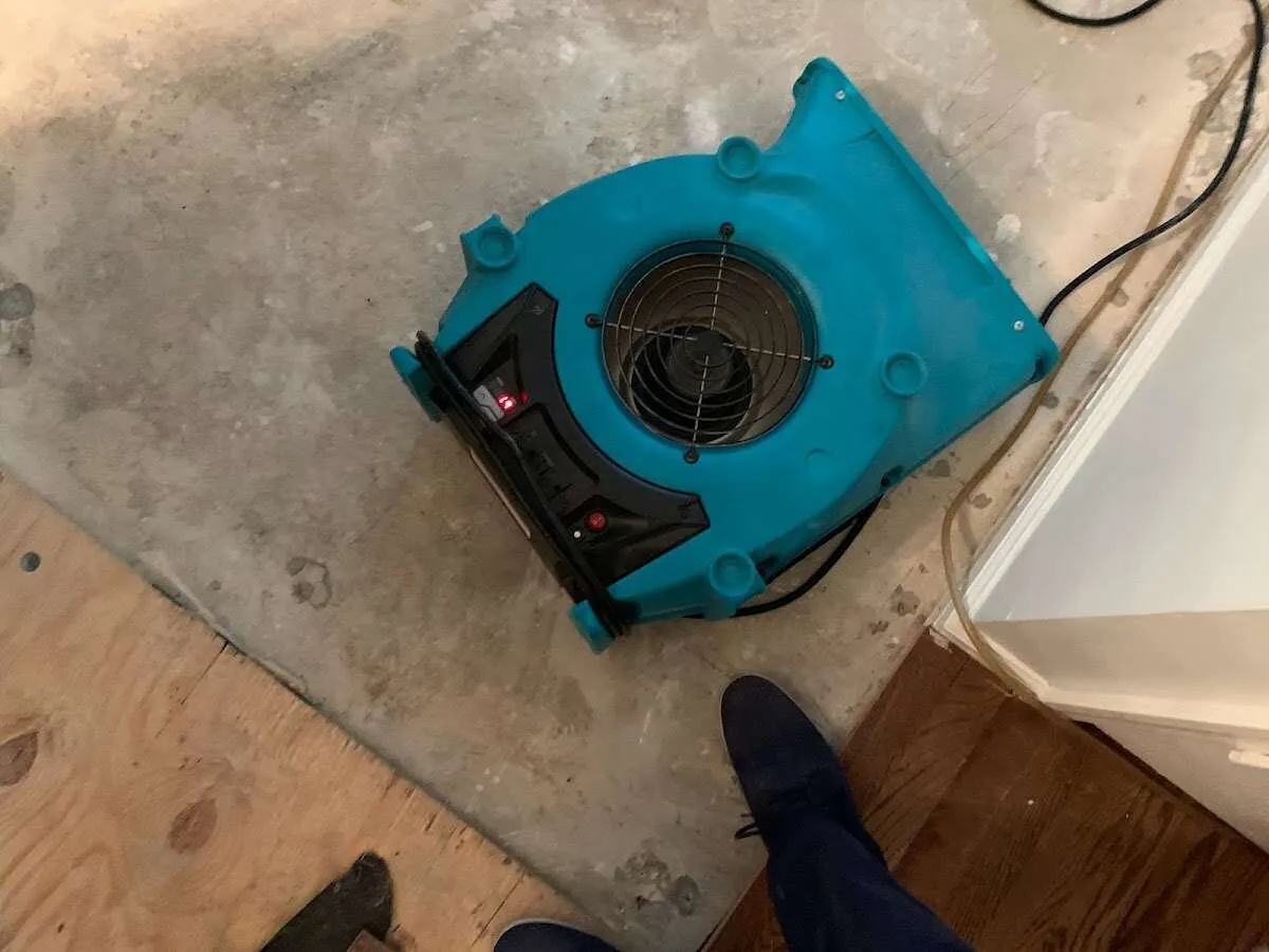 Air mover drying subfloor during Leak Detection & Repair in Boulder